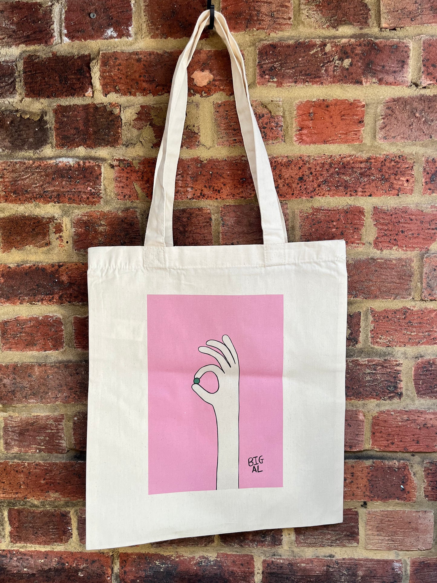 Hand Holding Pea Tote Bag